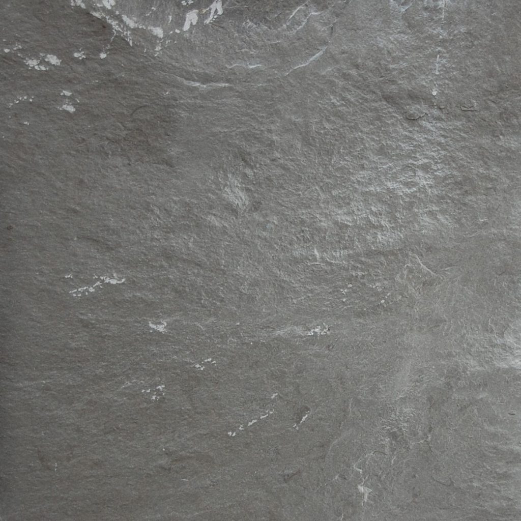 Gris Fontaine split face limestone cladding - a dark grey textured stone wall cladding