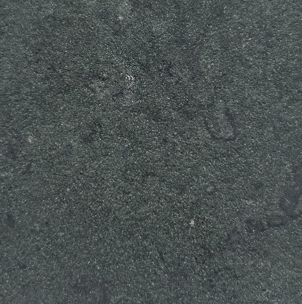 Anchor Green leather finish is a dark green limestone with occasional fossil and a slight texture on the surface.